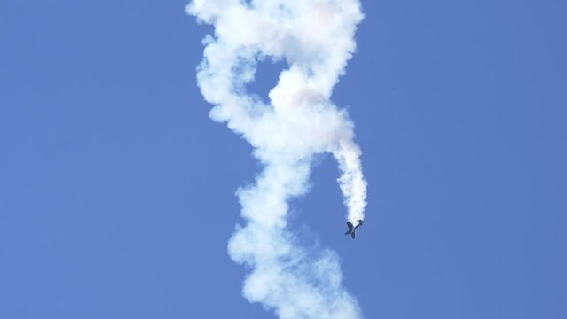 Melissa Burns in Edge 540 Stunt Aircraft in Flat Spin with Smoke Trail