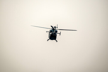 helicopter is flying on isolated sky