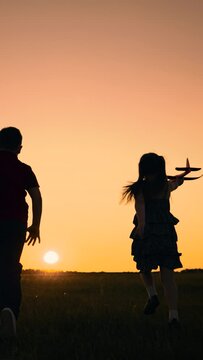 silhouette happy boy girl child play airplane pilot sunset, children family dream flying, happy kids running playing together wind, we unstoppable, summer vacation vlog, interest life, active family