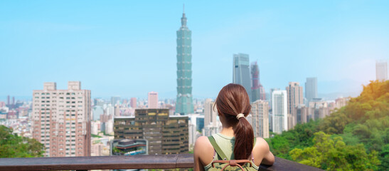 woman traveler visiting in Taiwan, Tourist looking Taipei City during sightseeing and hiking at...