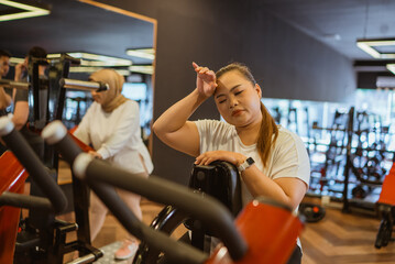 potrait of asian woman doing cardio workout exercise in gym
