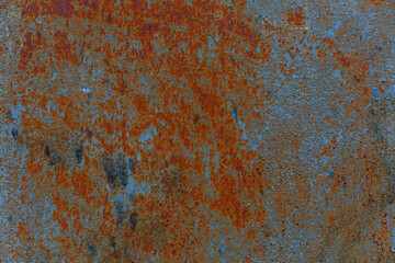 Surface of a rusty blue metal sheet. Construction and repair. Space for text. Background.