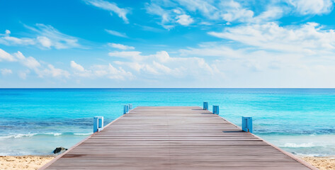 wooden pier on the ocean, wooden pier in the sea, a photo shows a pier and in the beach background...