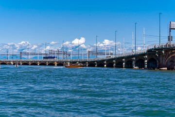 Mediterranean Sea at Italian City of Venice with wide angle view of car and railway bridge with Mediterranean Sea on a sunny summer day. Photo taken August 7th, 2023, Venice, Italy.