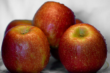 Five very appetizing apples on a white background