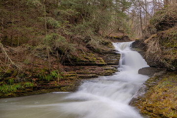 Afternoon winter photo of a waterfall in Robert H. Treman State Park near Ithaca NY, Tompkins County New York.  (01-13-2024)	