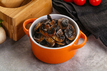 Roasted champignon mushrooms in the bowl