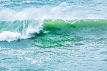 Wave splashing close-up. Crystal clear sea water, in the ocean in San Francisco Bay, blue water, pastel colors.