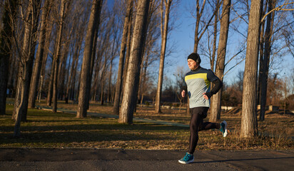 Runner joggin in the park in the winter