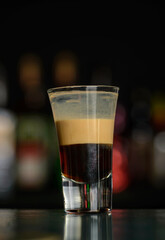 multi-layered cocktail shots at the bar