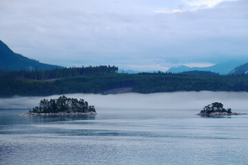 Islands off the coast of British Columbia rising from the fog, Canada