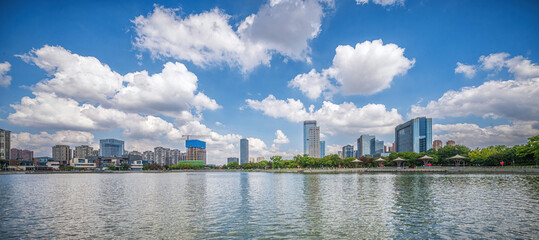 Clouds Over City and Reflective Waterfront © evening_tao