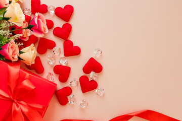 Valentine's Day decorations concept. Top view photo of gift boxes with rose and heart on pink background with copyspace