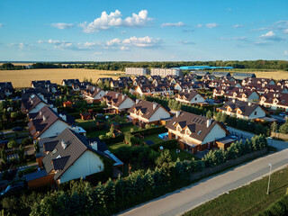 Aerial view of family houses in suburban neighborhood, Residential buildings in small town, Real...