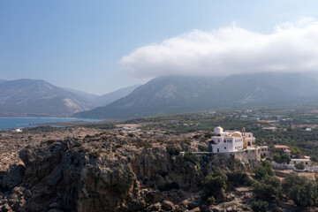 Fototapeta na wymiar Chania town Crete island, Greece, Chrysoskalitissa Monastery built up on rock. Aerial drone view.