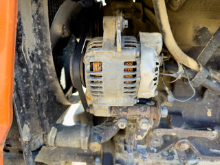 Alternator of a tractor closeup
