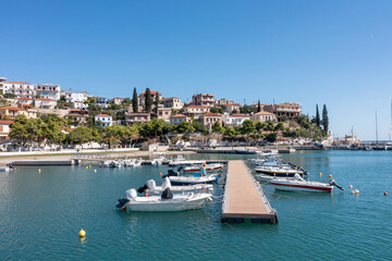 Fototapeta na wymiar Paralio Astros port, Arcadia, Peloponnese, Greece. Aerial drone view of village, moored boat in sea.