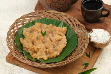 Tiwul is Indonesian traditional food that made ​​from processed cassava and palm sugar, serve with grated coconut.