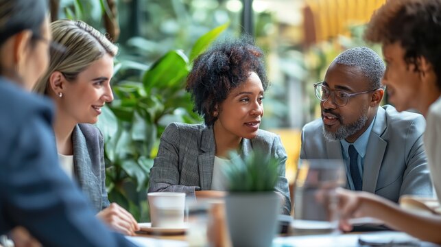 Diverse Professionals Discussing Mortgage Options in a Bright & Welcoming Office | Real Estate Finance, Home Loan, Mortgage Rates - Powered by Adobe
