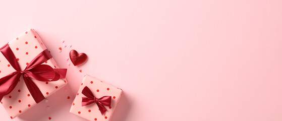 Valentine or Mother day banner design with gift boxes, red heart, confetti on pastel pink background.