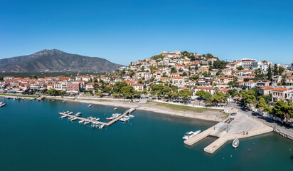 Fototapeta na wymiar Port Paralio Astros, Arcadia, Peloponnese Greece. Aerial drone panoramic view of town, moored boat.