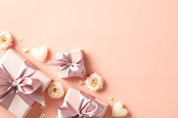 Happy Valentine's day flat lay composition with gift boxes, candles, flowers on beige background. Top view. - obrazy, fototapety, plakaty