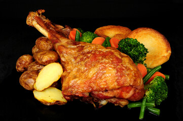 Roast turkey leg meal with potatoes, vegetables and Yorkshire puddings