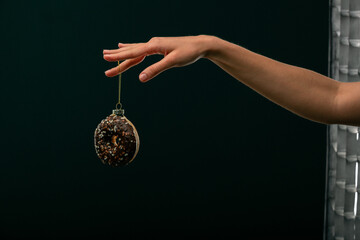 Donuts, bun, croissant Christmas toy on a black background. Creative collage.