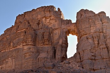 View of Tamezguida cathedrale rock formation in Tadrart Rouge rocky mountain range in Tassili n Ajjer National Park. Sahara desert, Algeria, Africa.