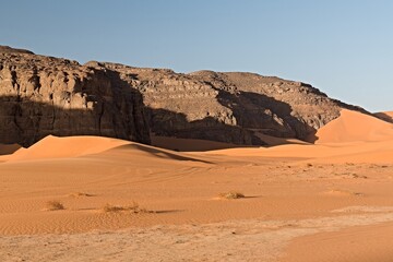 Fototapeta na wymiar View of the Tadrart Rouge rocky mountain range in Tassili n Ajjer National Park. Sahara desert, Algeria, Africa.