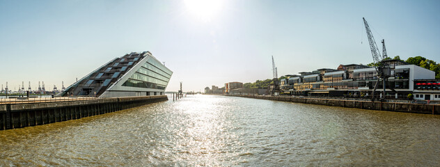 Panorama shot of the waterfront of the Elbe River and historic harbour area in Hamburg, Germany