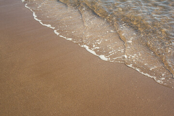 
It is a sandy beach with sea water.