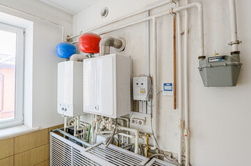 interior apartment room boiler room. heating system, pipes and appliances