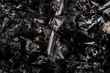 Tourmaline black crystals. Gems. Mineral crystals in the natural environment. Texture of precious...