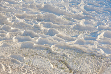 Pamukkale white mineral limestone natural pool at dawn. Turkey