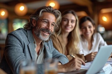 A diverse group of professionals had a happy collaborative office meeting discussing plans and documents.