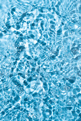 Water surface waving Close-up . Blue Water Flowing