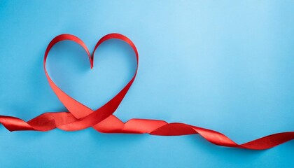 valentine day card or banner red heart of ribbon on blue background flat lay