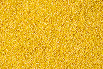 Background of raw millet seeds close up. Millet seeds texture.