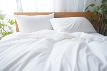  a bed with white sheets and pillows in a room with a plant on the side of the bed and a window behind it.