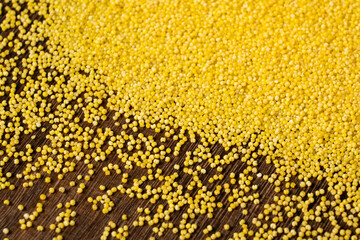 Background of raw millet seeds close up. Millet seeds texture.