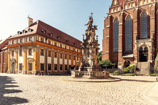 Poland, LowerSilesianVoivodeship, Wroclaw,Statue of John of Nepomuk in front of Collegiate Church of Holy Cross and St Bartholomew