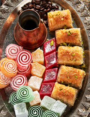 Traditional turkish coffee and turkish delight on dark  background.