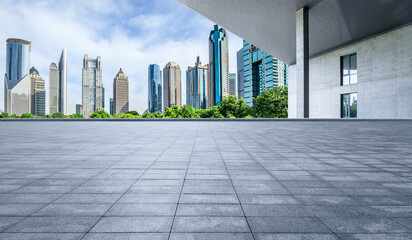 Empty square floor and wall with modern city buildings landscape in Shanghai - obrazy, fototapety, plakaty