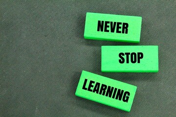 colored stick with the words Never stop learning