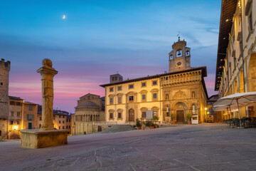 Fototapeta na wymiar Arezzo, Italy. View of historic architecture on Piazza Grande square at dusk