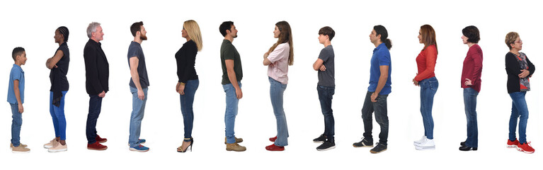 side  view of a group of women and men of various ages dressed in jeans on white background