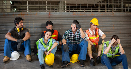 Depressed group of industrial worker tired of work or losing job from financial crisis. diversity...