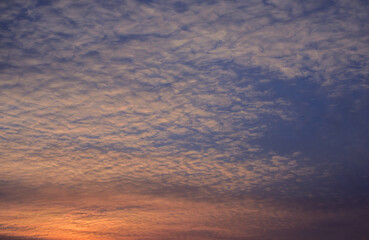 Sunset sky with orange clouds. Nature background.