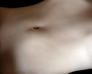 Naked woman belly. Close up. - 709616877